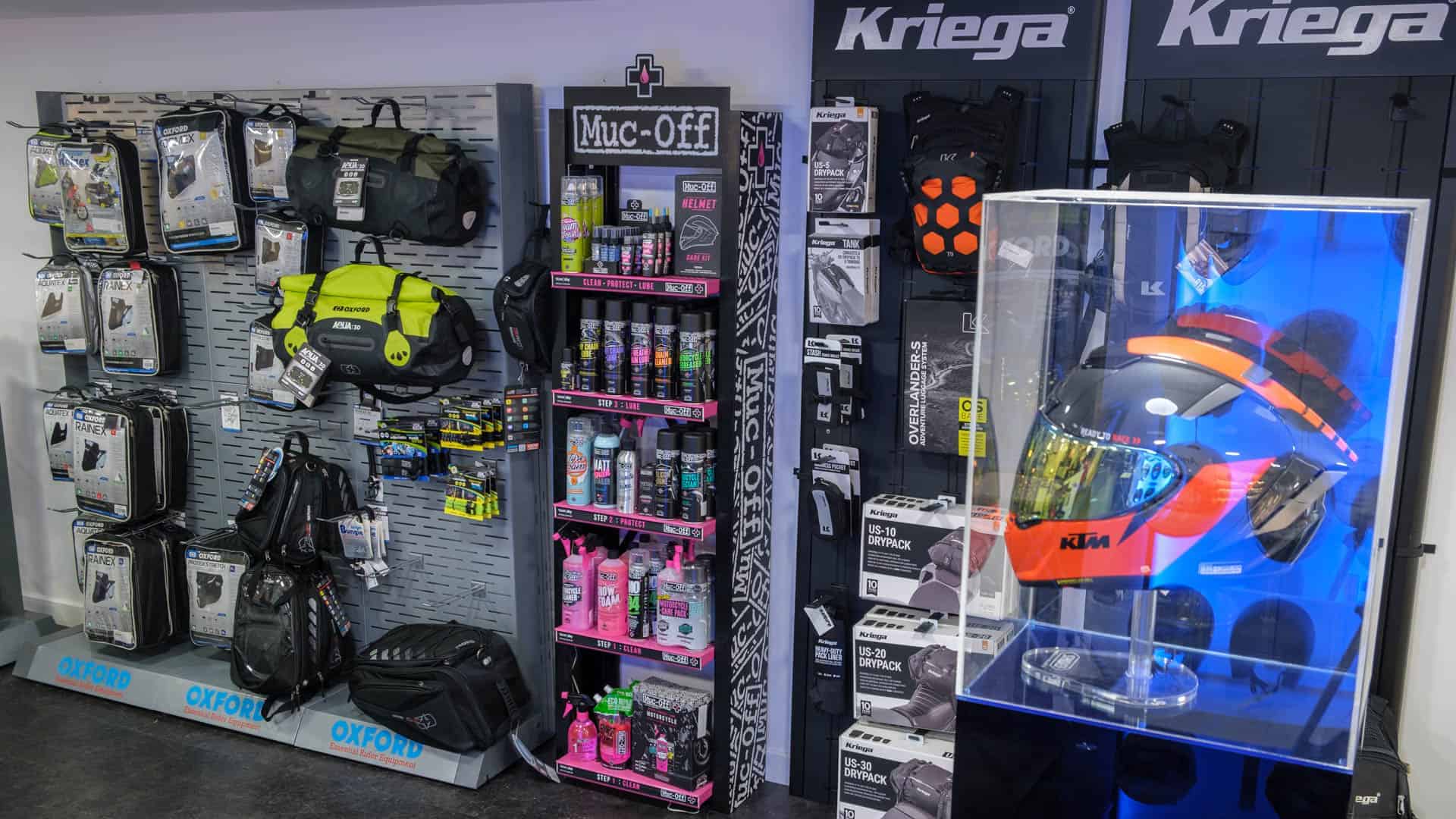 KTM helmet on display with muc-off products and motorcycle equipment