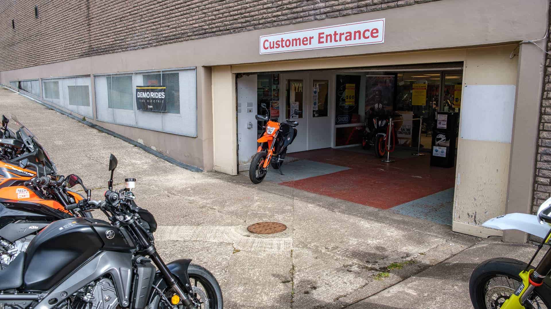 Image of customer entrance with motorcycles