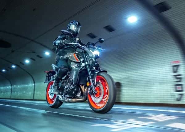 The all-new 2021 MT-09 action shot at night in the city